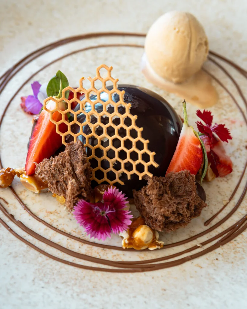 A plated chocolate dessert at Utopia Rooftop Restaurant